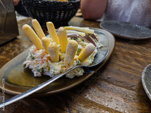 Ensaladilla rusa with breadsticks, anchovies and asparagus
