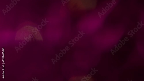 Illuminated twinkle. Blur glare. Defocused neon magenta pink purple color lens flare flicker sparkle gleam glimmer shine on abstract bokeh background.