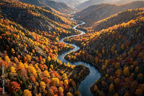 River snaking through a valley of autumn colors seen from the air