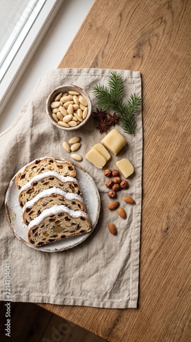Festive holiday bread slices with nuts and cheese on rustic linen cloth near window