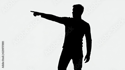 Silhouette of a man pointing against a white background