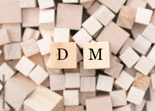  Direct massage concept. Abstract geometric wooden dice.   DM icon.