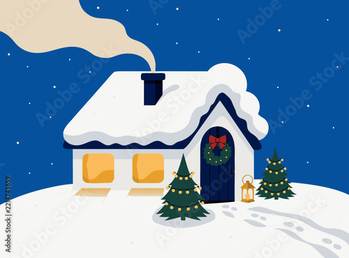 Cozy winter house with wreath and lit windows on a snowy evening