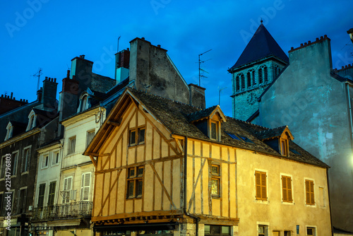 Obraz na plátně Historic rooftops and half-timbered houses at dusk in Dijon, France