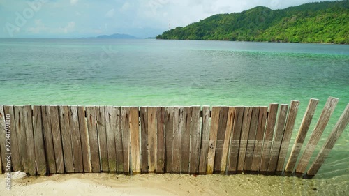 Wooden Fence Along Tropical Beach