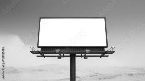 Blank rectangular billboard standing alone against vast snowy landscape under overcast sky