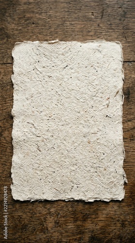 Old Rustic Paper on Wooden Surface for Creative Projects.
