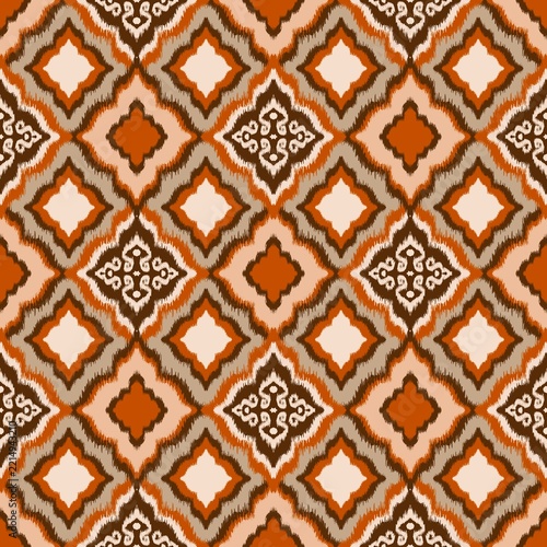 Illustration of an orange abstract geometric ikat pattern.