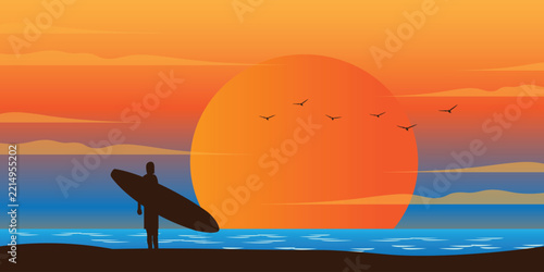 Surfer holding surfboard on beach during beautiful golden sunset