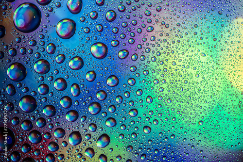 water drops macro photography with colorful rainbow reflections and colorful background