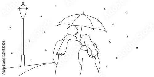 Romantic couple walking together under umbrella in winter snow
