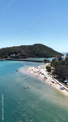 Tallebudgera Creek aerial drone footage over the creek mouth and sandbar, Gold Coast, Queensland Australia - vertical video