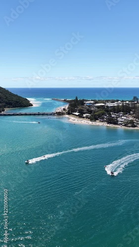 Tallebudgera Creek aerial view of the bridge, sandbanks and turquoise water, Gold Coast, Queensland Australia - vertical video