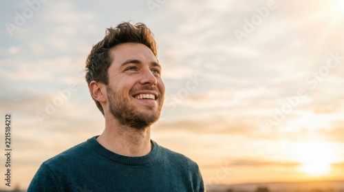 Handsome Young Man Looking Upwards With A Joyful Expression Enjoying The Sunset Sky Outdoors Feeling Inspired Hopeful And Positive Mental Wellbeing