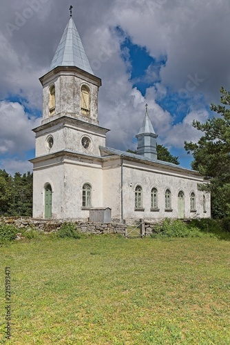 Hellamaa Orthodox Church, also known as the Church of Saints Peter and Paul, located on Muhu Island in Estonia in summer with clouds in the sky, Europe.