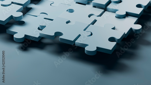 Blue 3d puzzle pieces fitting together in close-up