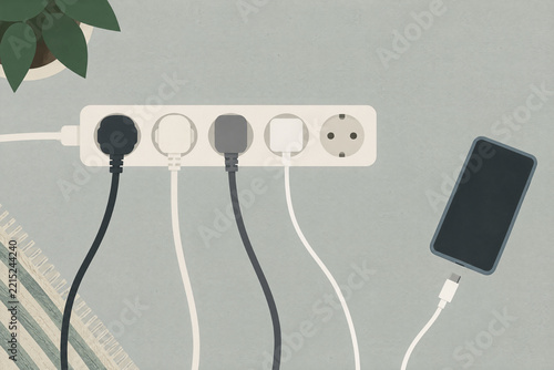 Power strip and smartphone on a tabletop