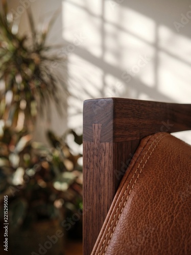 Wooden armchair joinery and leather upholstery showcasing artisanal woodworking details for interior design projects