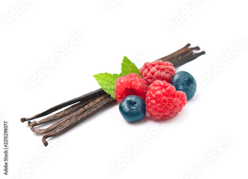 Swett berries raspberries and blueberries with vanilla pods