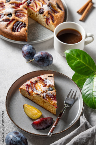 Homemade plum pie for breakfast and a cup of coffee