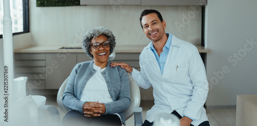Senior patient with dentist during dental consultation in a modern clinic