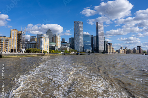 Canary Wharf Skyline and Isle of Dogs Across Boat Wake on River Thames
