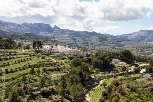 view of Aitana Mountain with Benimantell village in the center, comarca of Marina Baja, province of Alicante, Valencian Community, Spain