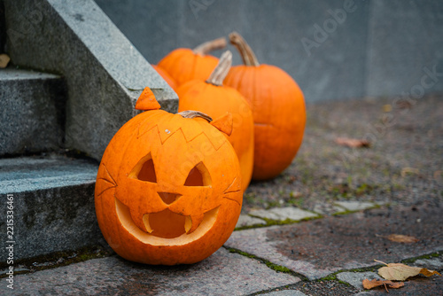Carved pumpkins and jack-o'-lanterns on a street at Halloween