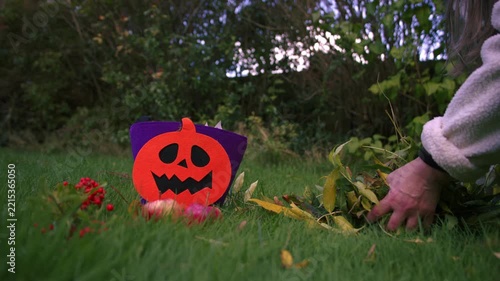 Collecting Autumn leave at Halloween