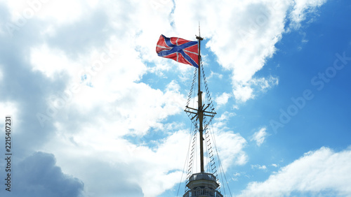 Russian naval jack and fortress flag waving on a mast