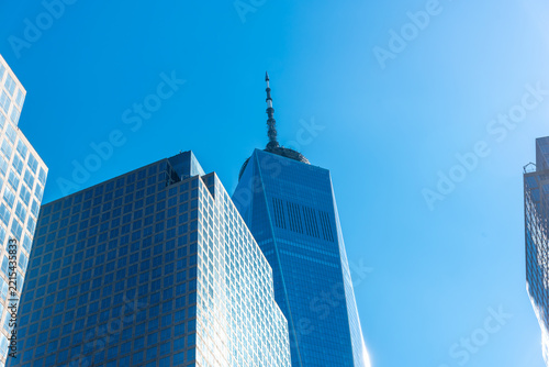 Modern skyscraper details in Lower Manhattan under blue sky