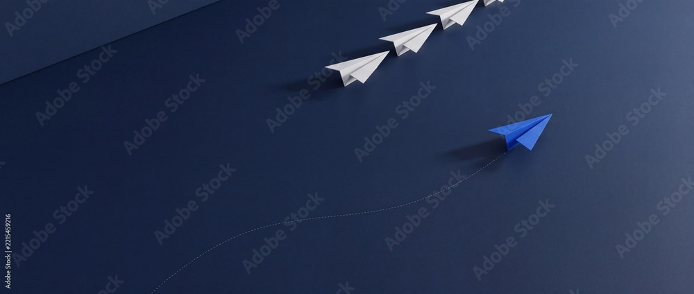 Fototapeta premium Blue paper airplane changing direction and shifting perspective from a line of white planes on a dark blue background, symbolizing leadership, innovation, and breaking conventional patterns.