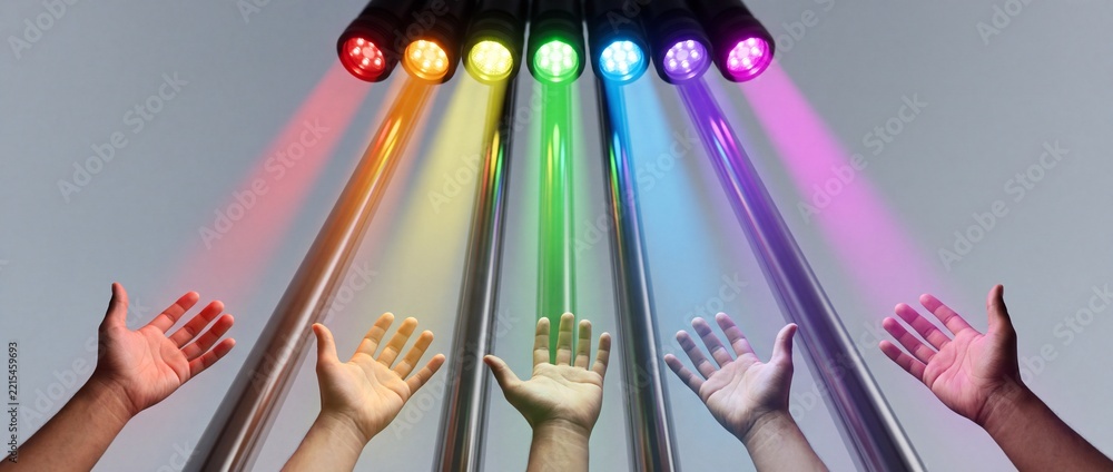 Fototapeta premium Conceptual wide-angle shot of human hands reaching out toward vibrant rainbow-colored LED light beams against a neutral background, symbolizing hope, diversity, unity, and creative inspiration.