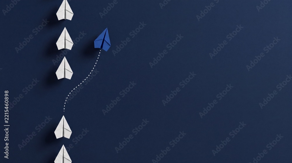Fototapeta premium Blue Paper Plane Changing Direction from White Group on Navy Background Representing Business Innovation, Premium Growth, Success, Leadership and Unique Strategy for Corporate Excellence