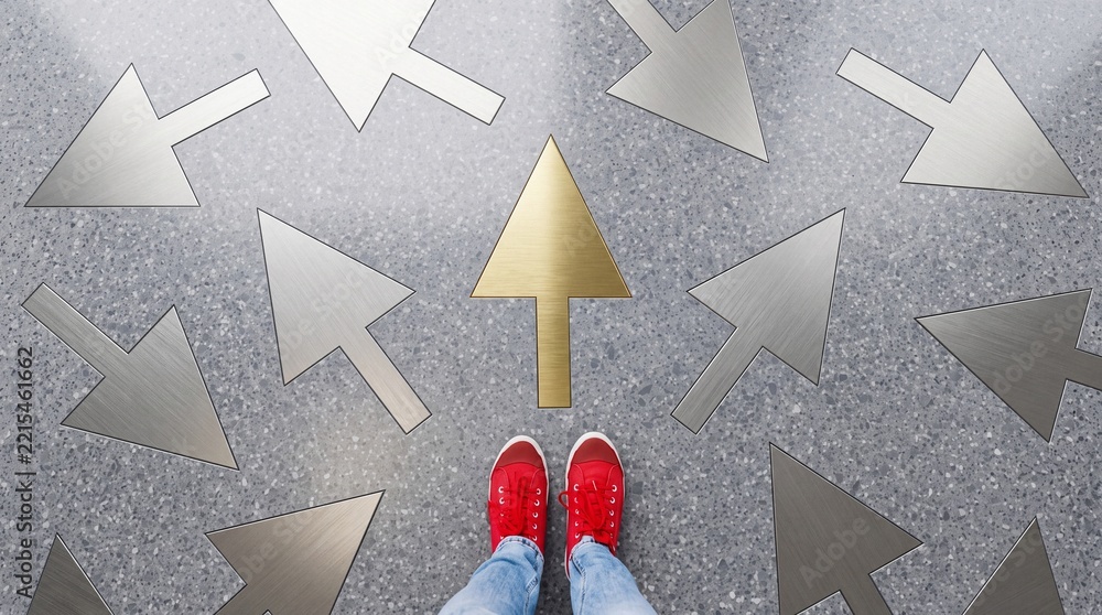 Fototapeta premium Person in Red Sneakers Standing on Stone Floor with Multiple Metal Arrows, One Gold Arrow Pointing Forward Symbolizing Success, Unique Career Path, Leadership, and Premium Choice Decision