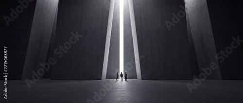 Three tiny silhouettes of people standing in a massive, minimalist dark concrete hall facing a bright vertical light opening, conceptual cinematic wide shot of hope, discovery, and future goals.