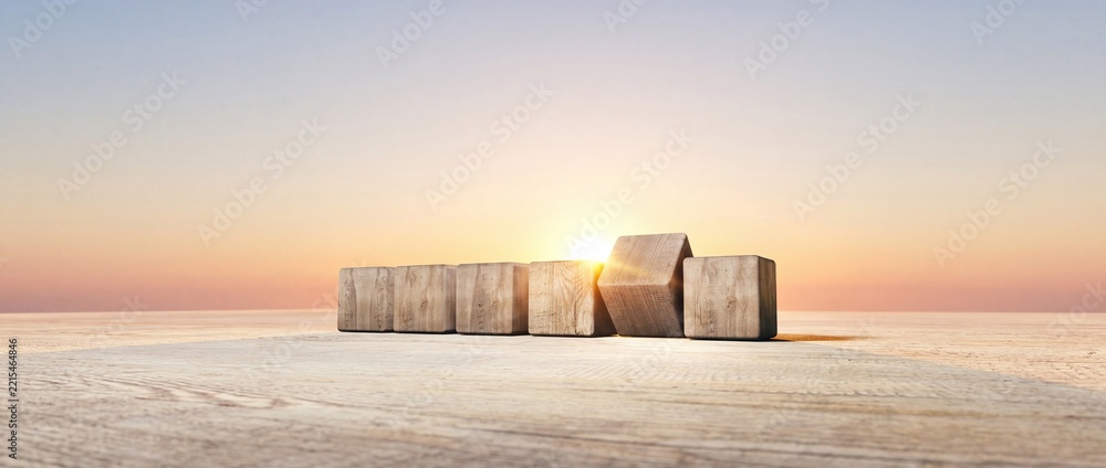 Fototapeta premium Conceptual wide angle view of blank wooden cubes on a wooden deck at sunrise representing a new beginning, future planning, business strategy, career growth and the start of a successful journey.