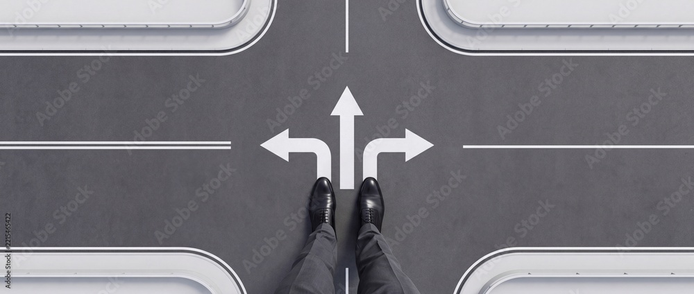Fototapeta premium Businessman Standing at a Crossroad Faced with Three Directional Arrows on Asphalt Road, Concept of Career Choice, Strategic Decision Making, and Future Business Direction in Wide Context Format