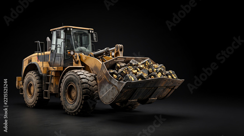 Heavy wheel loader bucket full of gold ore rocks for mining industry on black background.