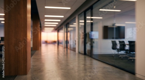 Modern office hallway with glass partitions and meeting room corridor interior
