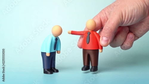 The boss reprimands the subordinate for poor work and fires him. Job losses and layoffs are occurring at the company. Corporate restructuring, workforce reduction and economic instability in business.
