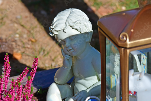 sweet dreaming angel figure on a grave