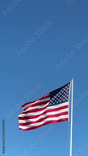 American Flag Against a Blue Sky wih Space for Copy