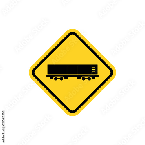 Yellow diamond warning road sign with a black cargo train carriage icon.