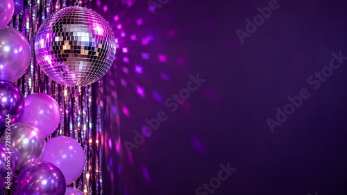 Mirrored Disco Ball and Metallic Balloons Against Purple Party Lighting