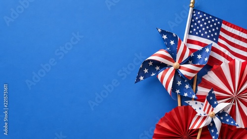 Patriotic Paper Pinwheels Stars and Fans on a Blue Background with Space