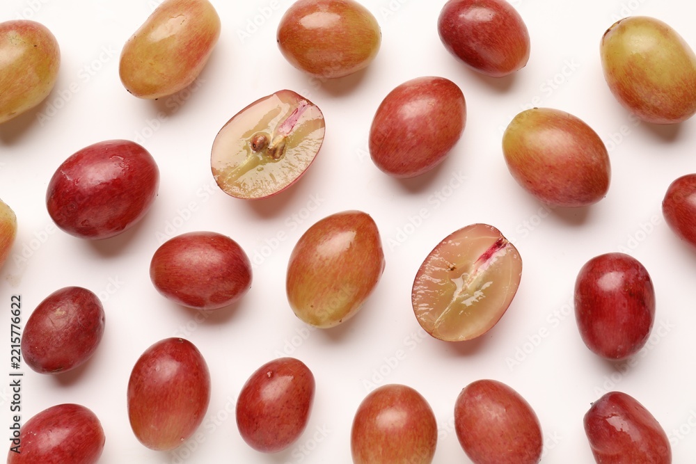 Fototapeta premium Fresh ripe grapes on white background, flat lay