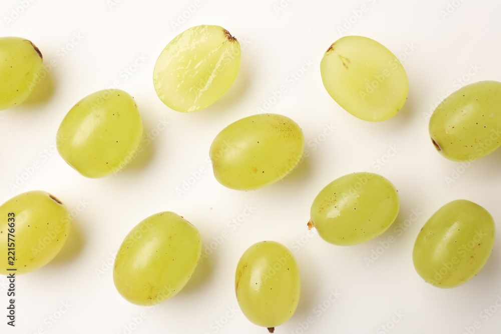 Fototapeta premium Fresh ripe grapes on white background, flat lay