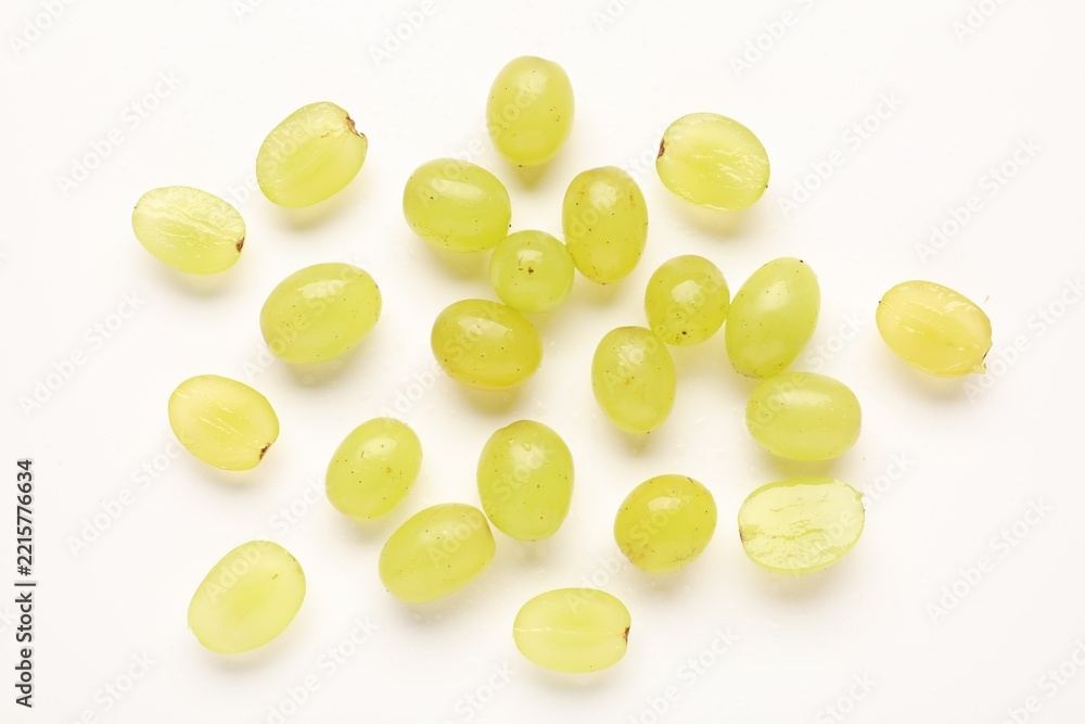 Fototapeta premium Fresh ripe grapes on white background, flat lay