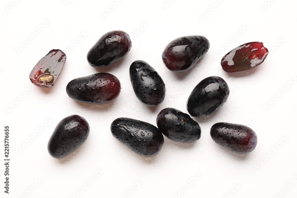 Fototapeta premium Fresh ripe grapes on white background, flat lay